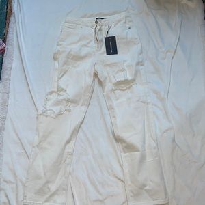 Size 8. Pretty Little Things white distressed jeans. Never worn
